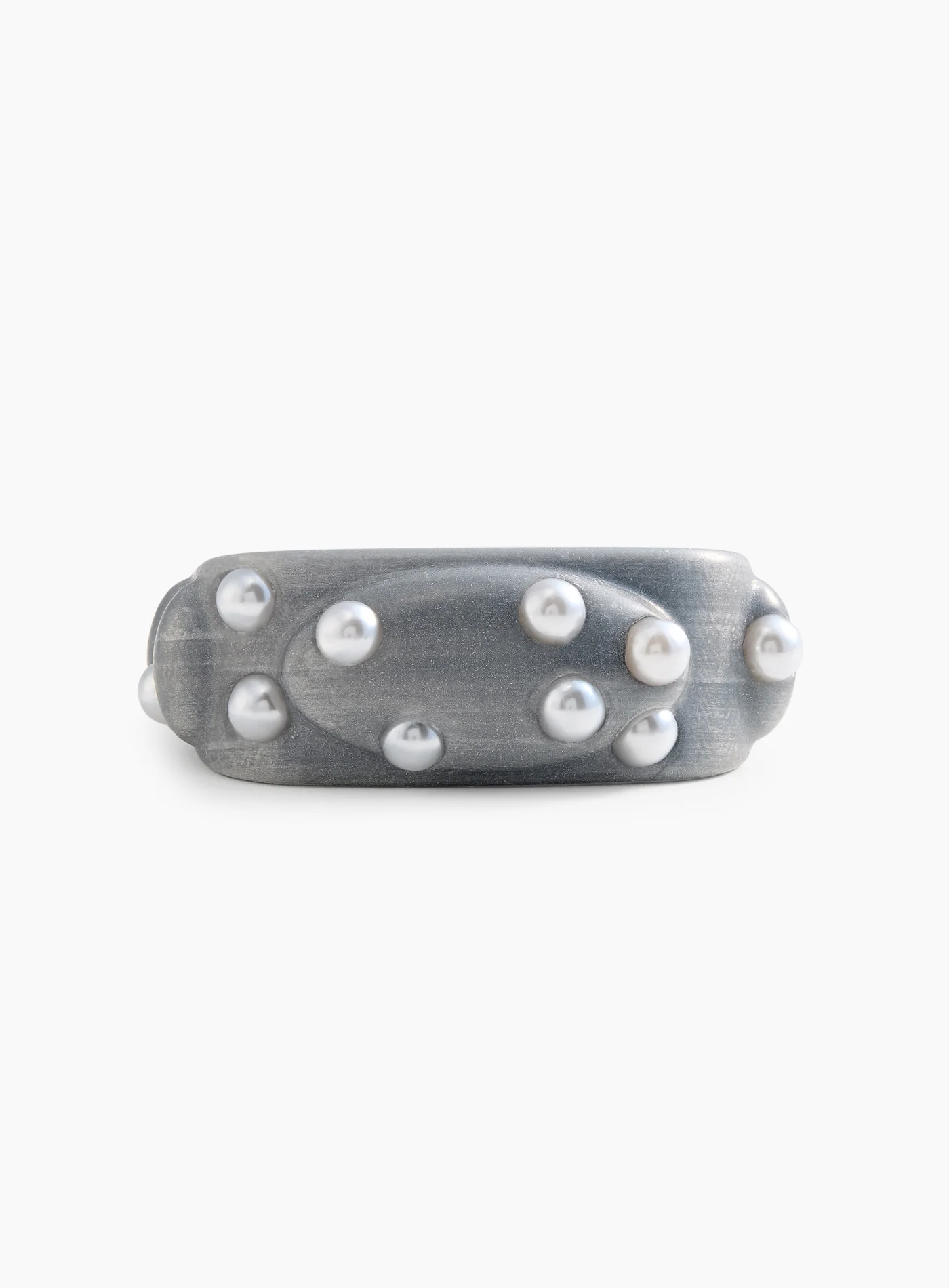 Silver bangle on perla topping